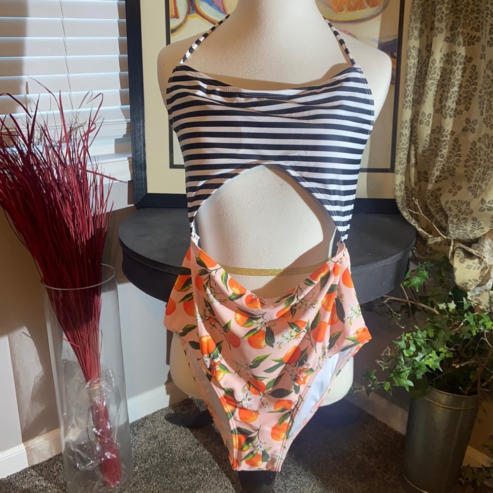 Bikini like one piece swimsuit. Orange floral black and white size L